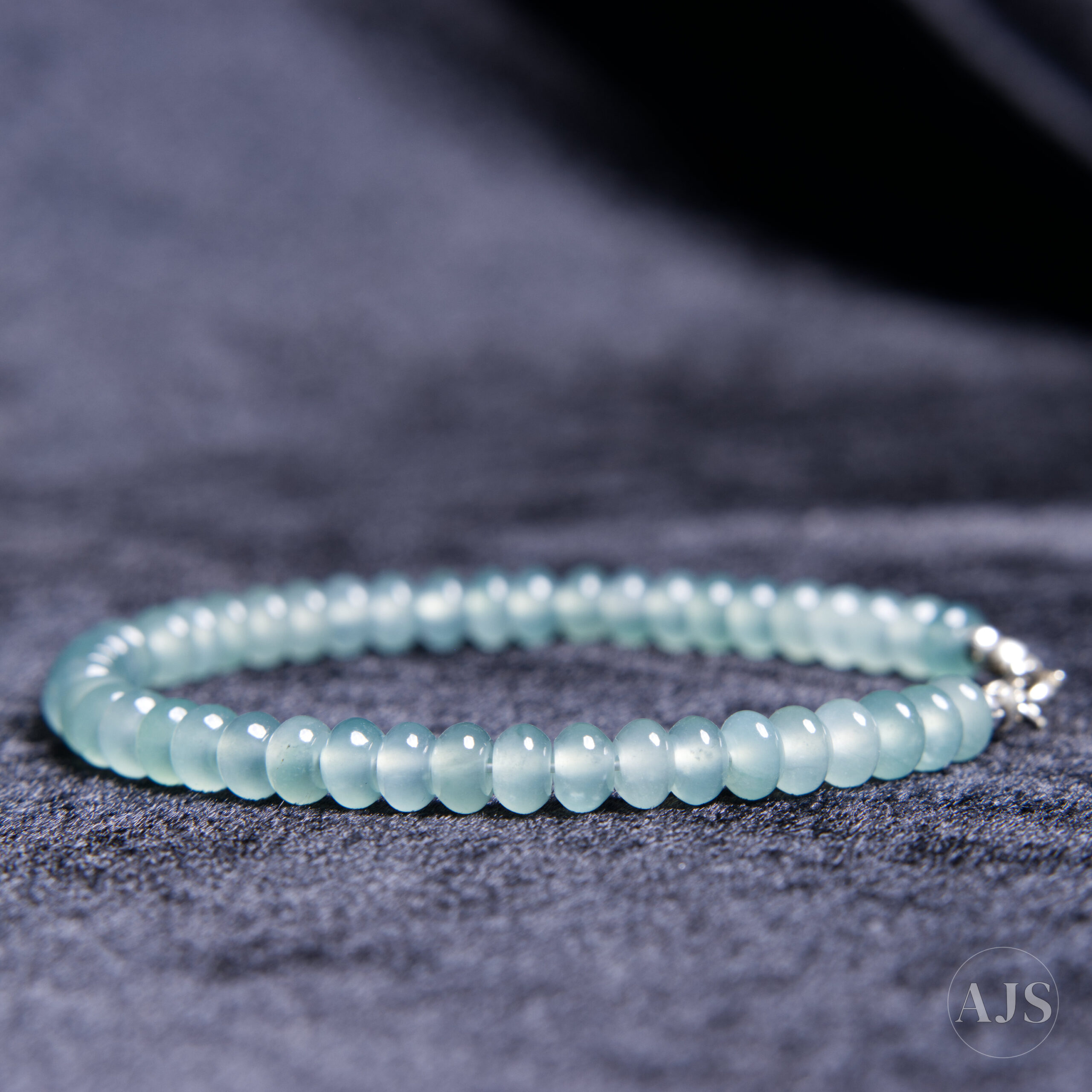 Sea-green Guatemalan jadeite rondelle beads with natural tonal variation